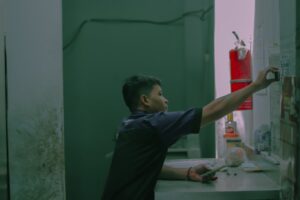 Maintenance technician inspecting a fire extinguisher.