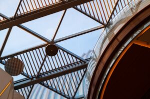Close-up of architectural detail showing exposed beams and modern fixtures
