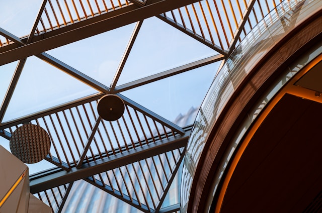 Close-up of architectural detail showing exposed beams and modern fixtures