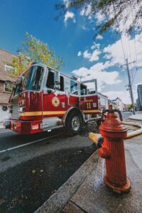 Fire truck parked next to commercial building showing access