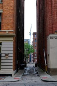 Service lane behind commercial building showing rear setback