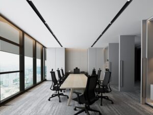 Bright office interior with natural light streaming through large windows