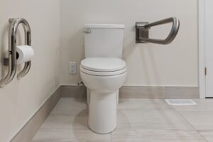 Accessible commercial restroom with grab bars