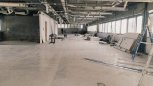 Commercial building undergoing renovation with scaffolding.
