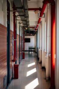 Commercial building ceiling with exposed fire sprinkler piping