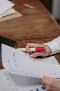 Fire alarm inspection log and test report on a clipboard