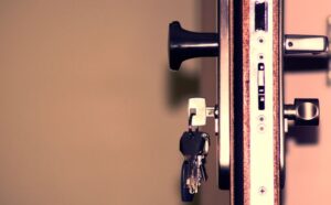 Close-up of a keyed lock cylinder on a commercial door.
