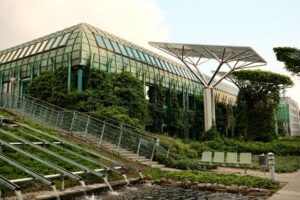 Modern green commercial building with solar panels and green roof