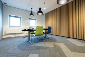 Modern office interior with acoustic panels on the ceiling and walls