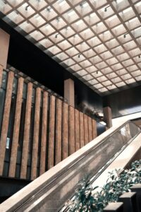 Acoustic ceiling clouds in a commercial building lobby