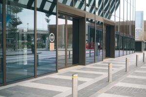 Bollards and security gate at a commercial building entrance